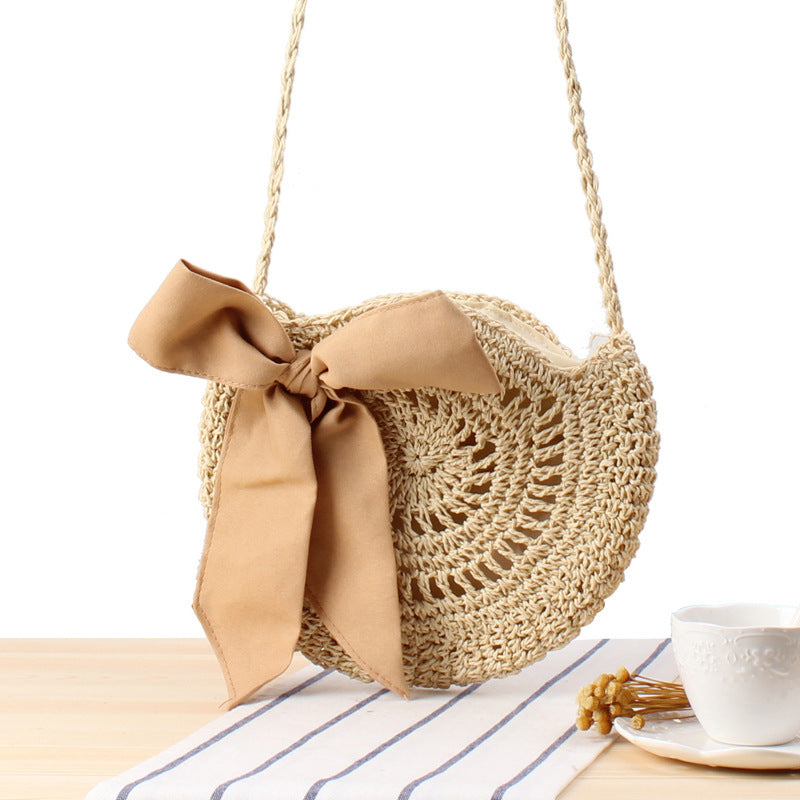 Straw bow crossbody woven bag