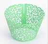 Cupcakes With Paper Cutouts Around The Edge Of The Cake Cups