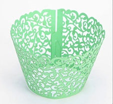 Cupcakes With Paper Cutouts Around The Edge Of The Cake Cups