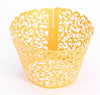 Cupcakes With Paper Cutouts Around The Edge Of The Cake Cups