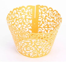 Cupcakes With Paper Cutouts Around The Edge Of The Cake Cups